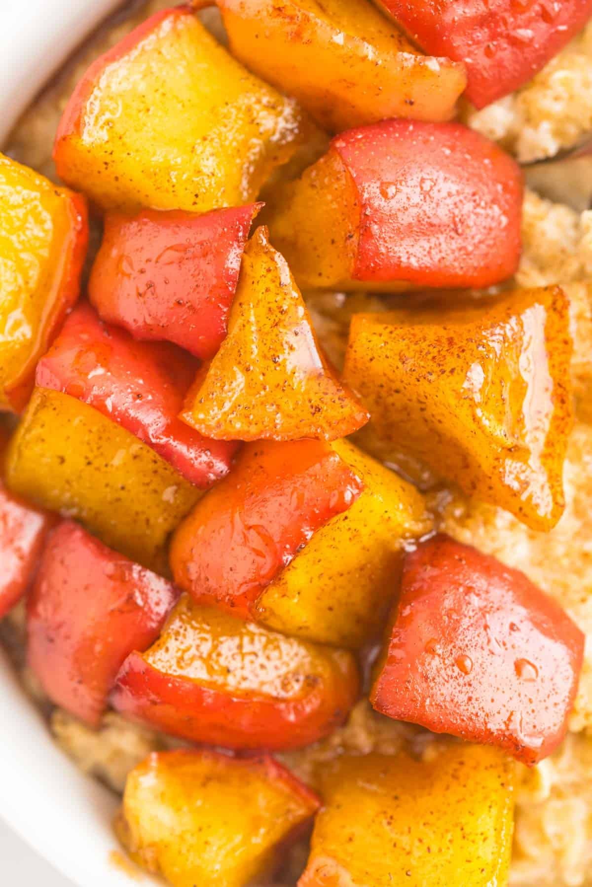 Close up of cooked diced apples in a cinnamon syrup.
