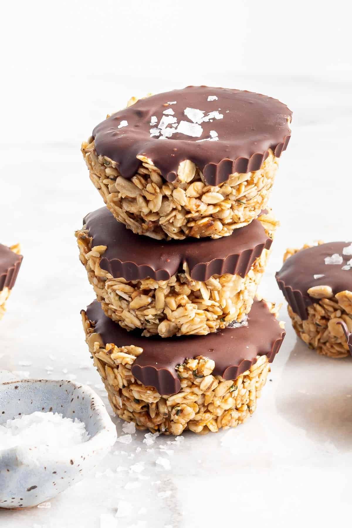 Oatmeal cups with fudge topping, stacked three high.