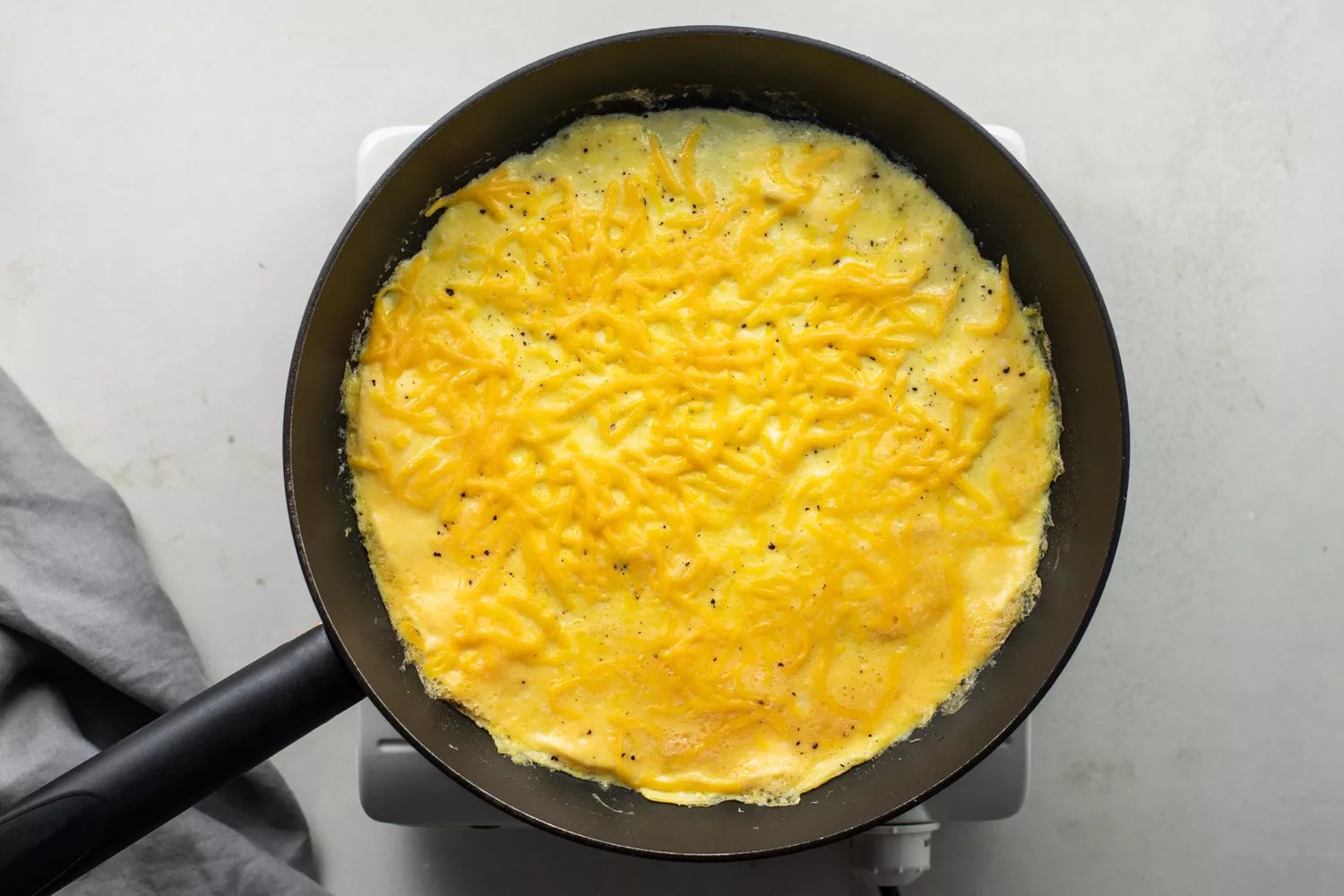 Lightly browned set eggs in the frying pan