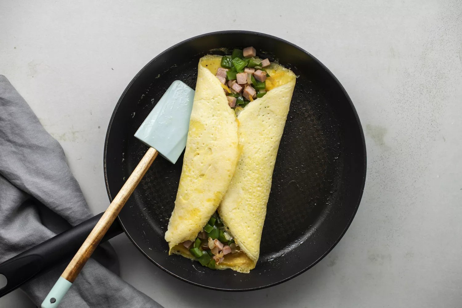 Sides of the omelet folded over the filling to the center