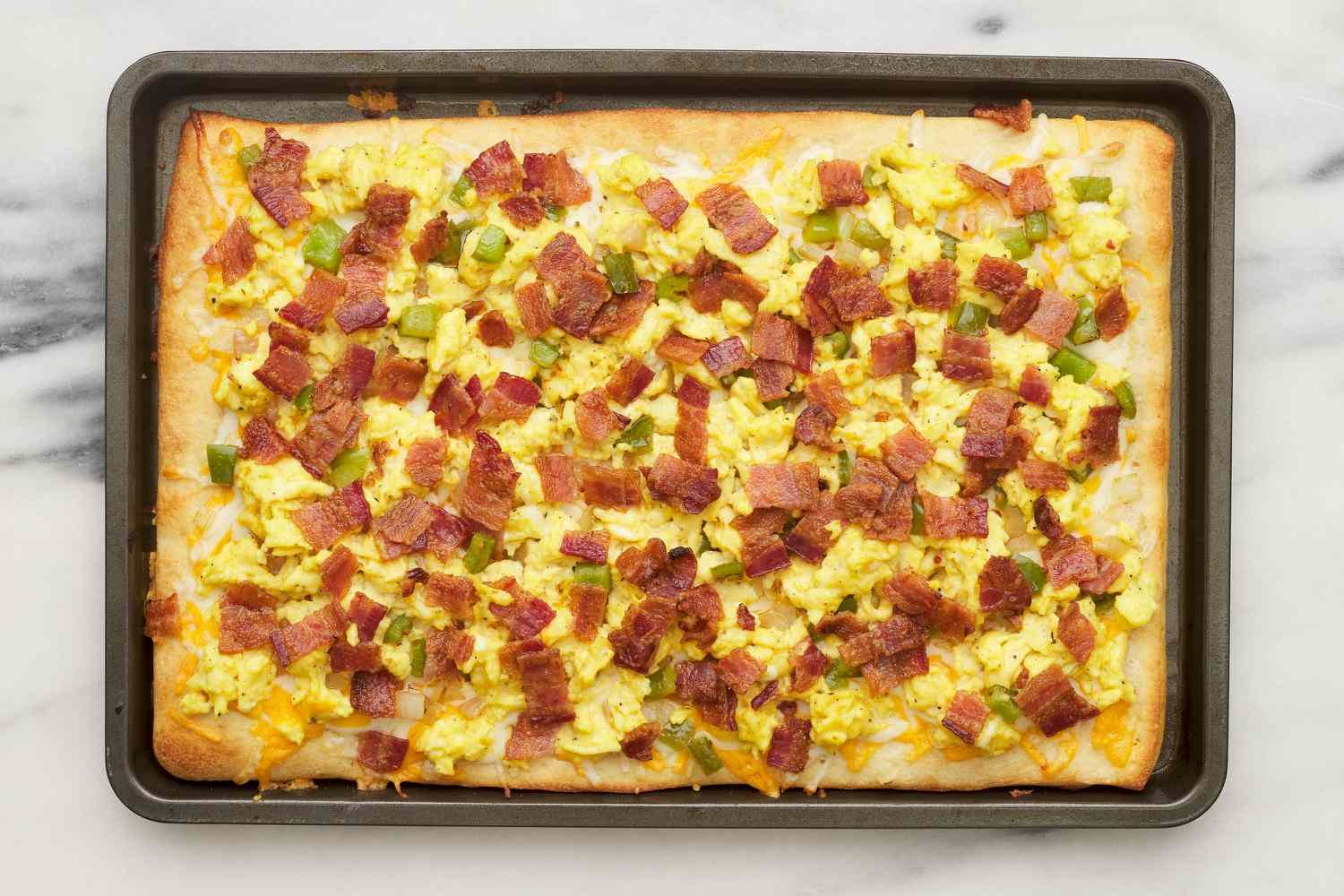 baked breakfast pizza with melted cheese