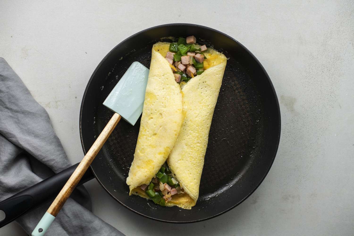 Sides of the omelet folded over the filling to the center