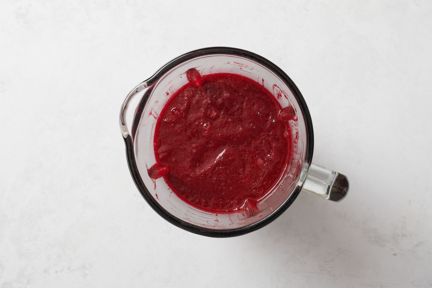 A blender with ingredients for beet mix
