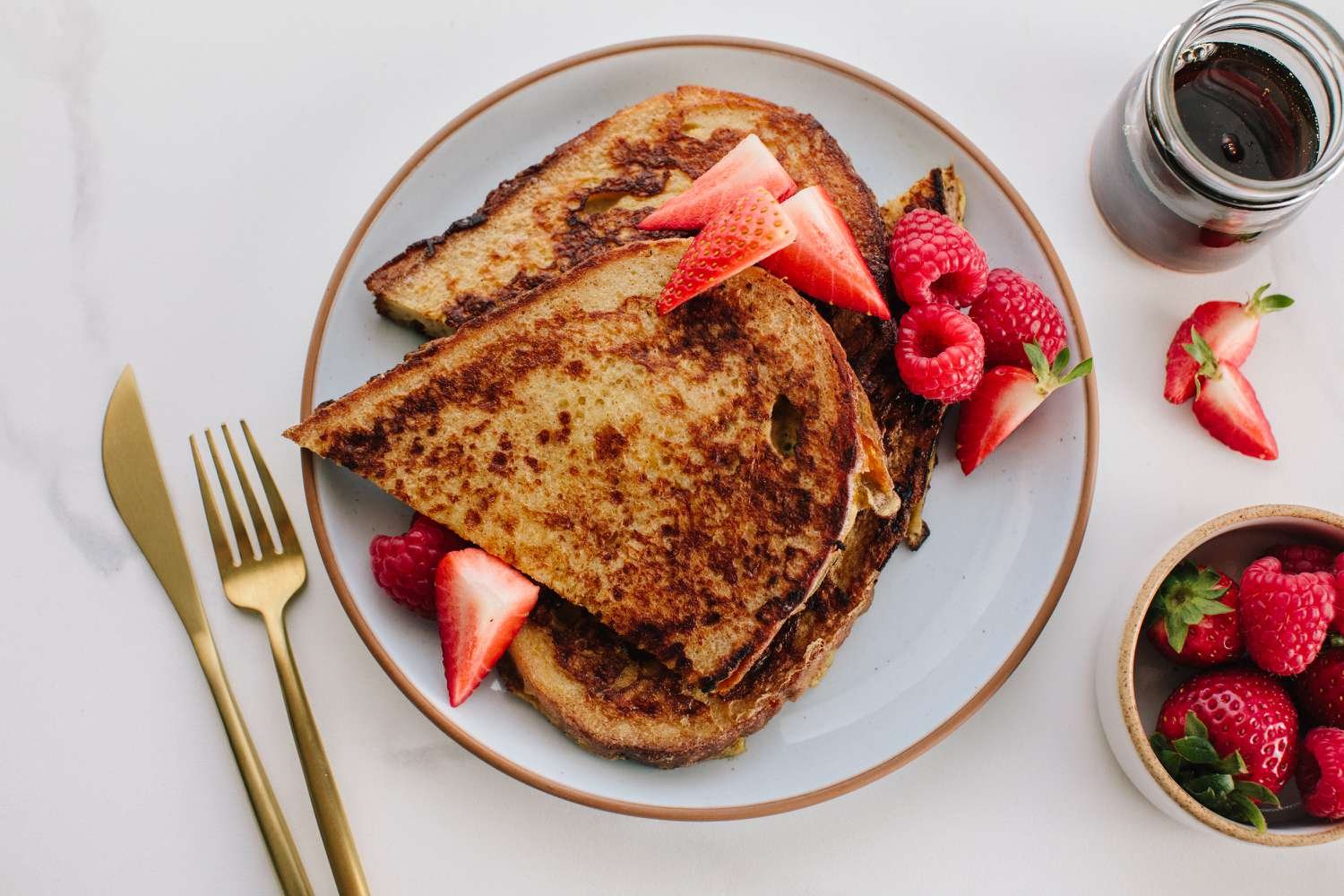 Sourdough French toast on a plate with berries