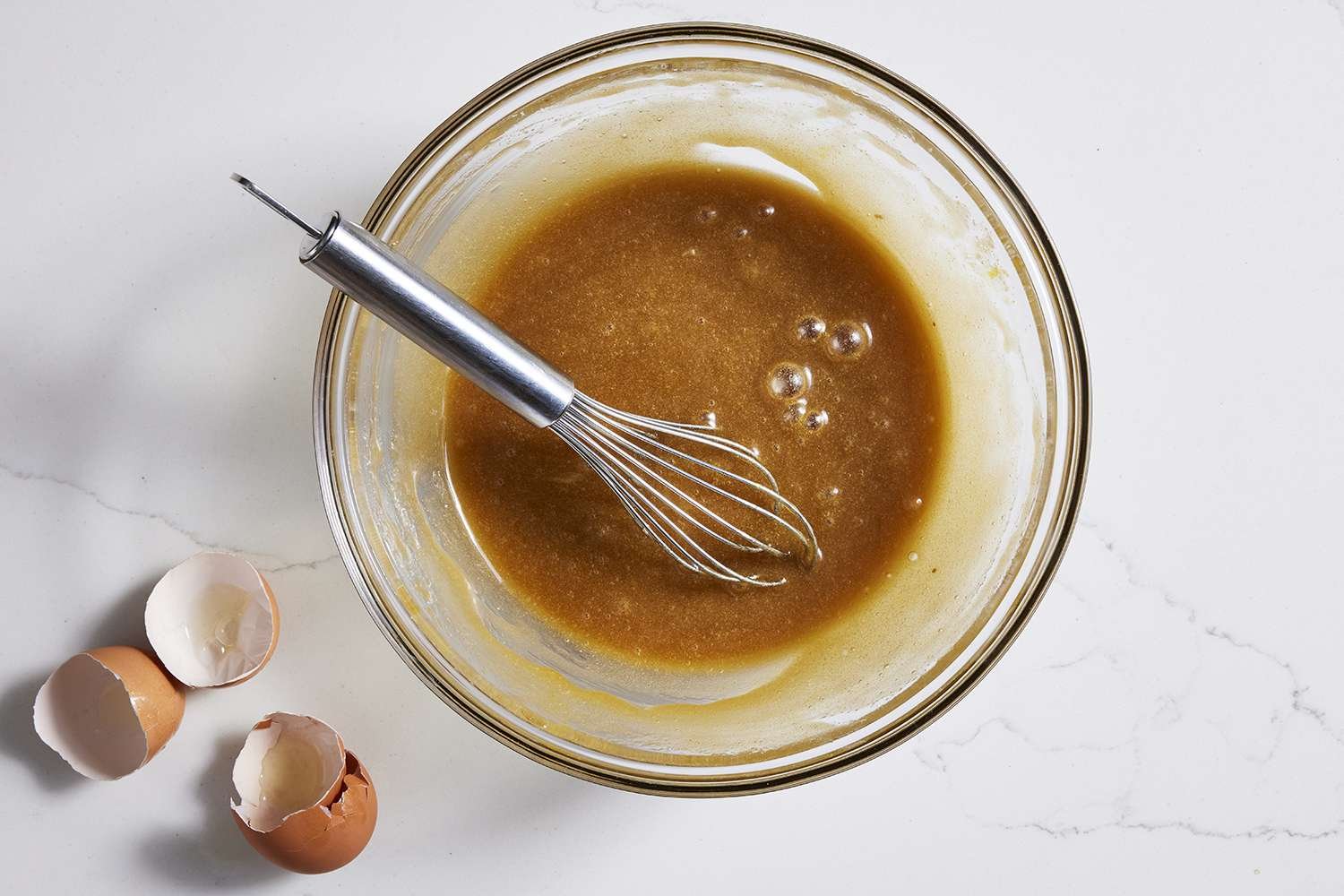 Eggs whisked into brown sugar mixture