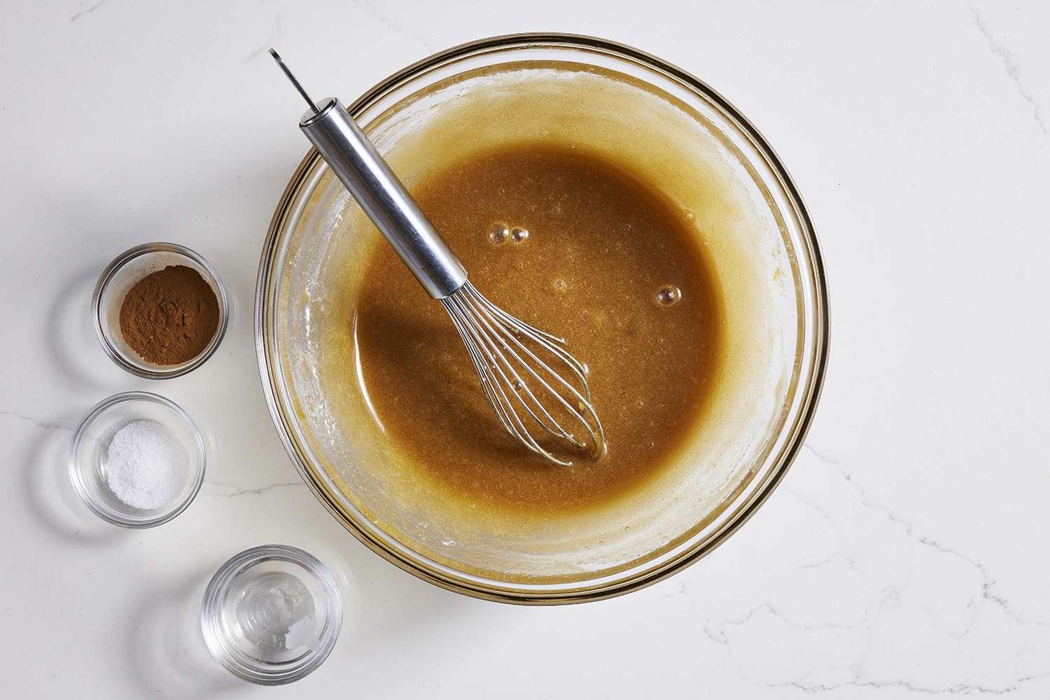 Spices and baking powder being added to wet ingredients