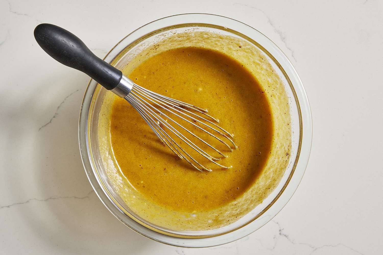 yogurt and pumpkin puree added to wet ingredients in bowl