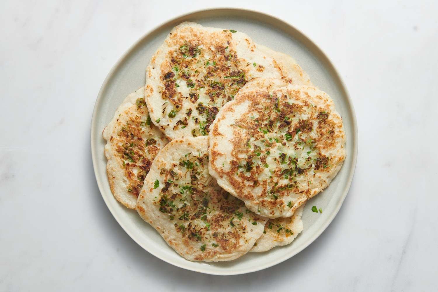 Platter of cooked uttapam