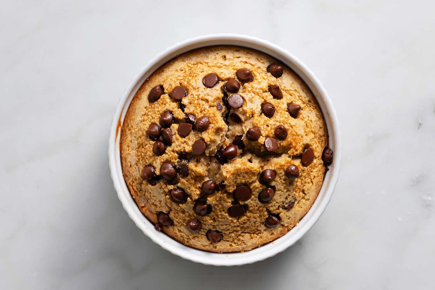 Blended Baked Oats with chocolate chips in a ramekin