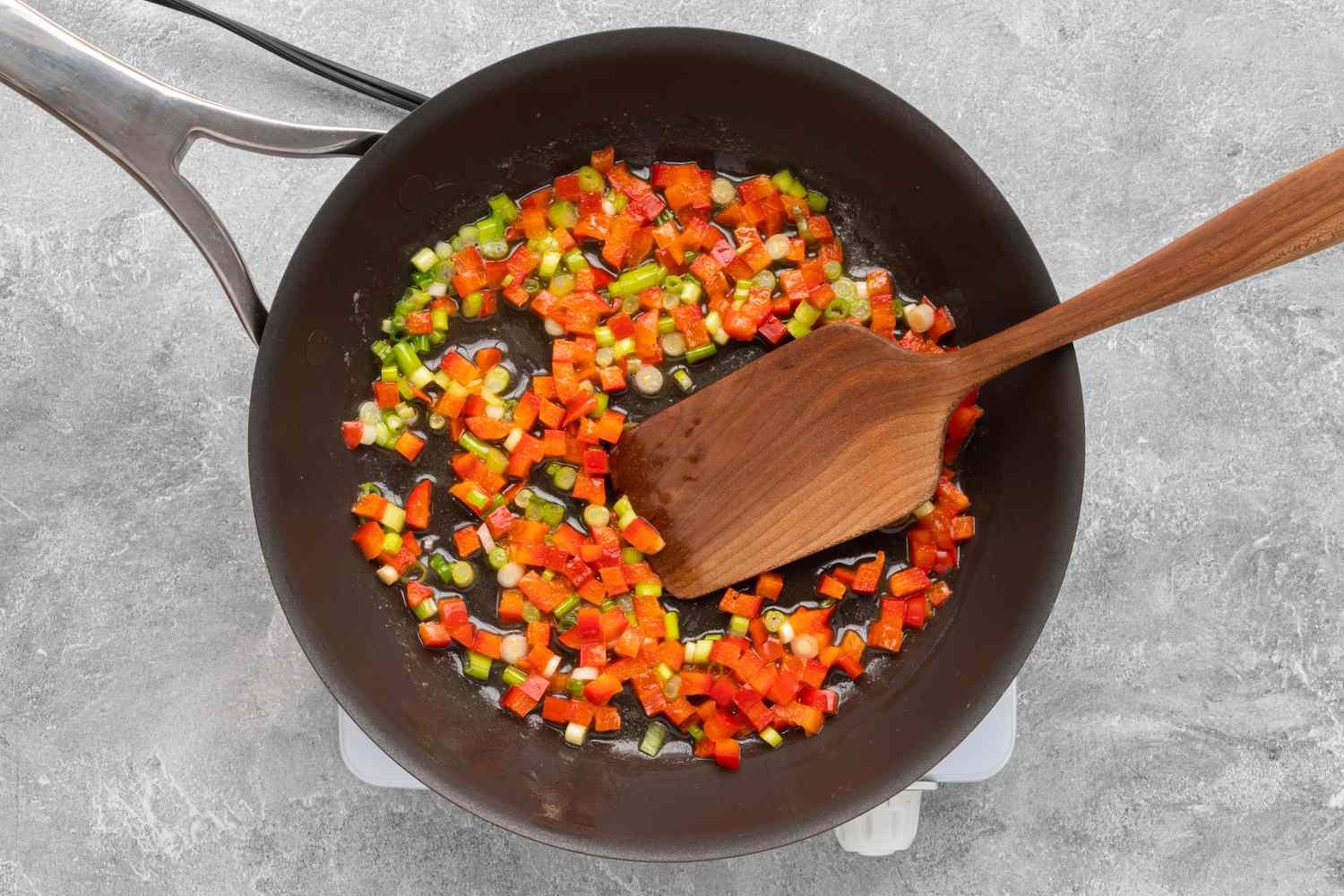 sauté the green onions and bell peppers