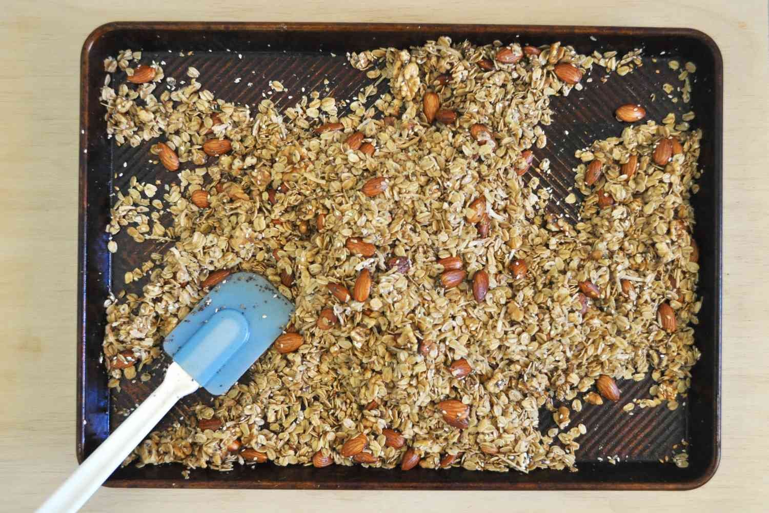 Granola baking on a sheet pan