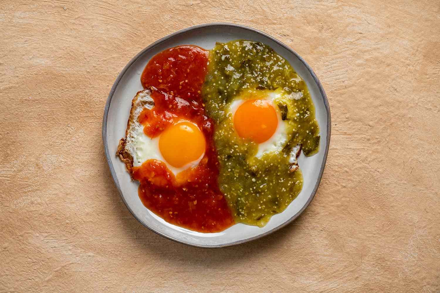 Eggs with salsa verde and salsa roja on a plate 