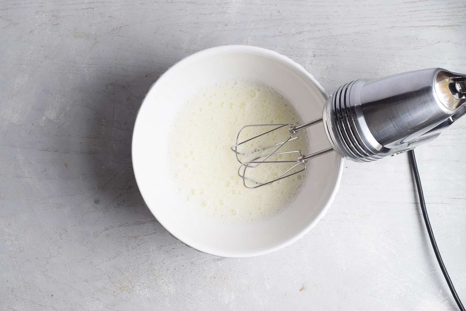 Beaten egg whites in a bowl
