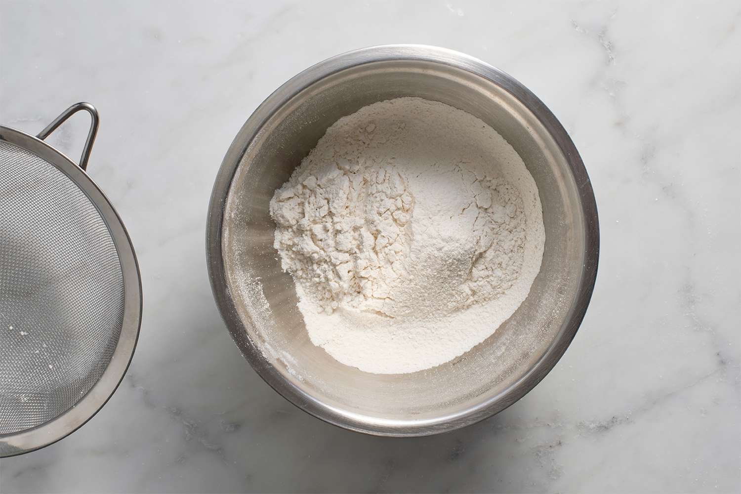 Flour, baking soda, baking powder, and salt in a bowl