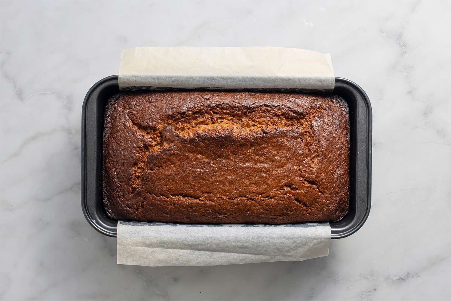 Freshly baked Peanut Butter Banana Bread in a loaf pan