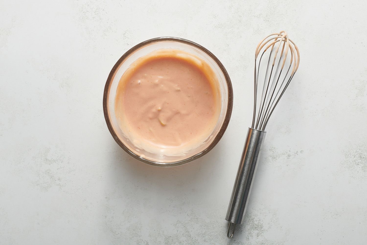 mayo, ketchup, and peppers mixed in a bowl