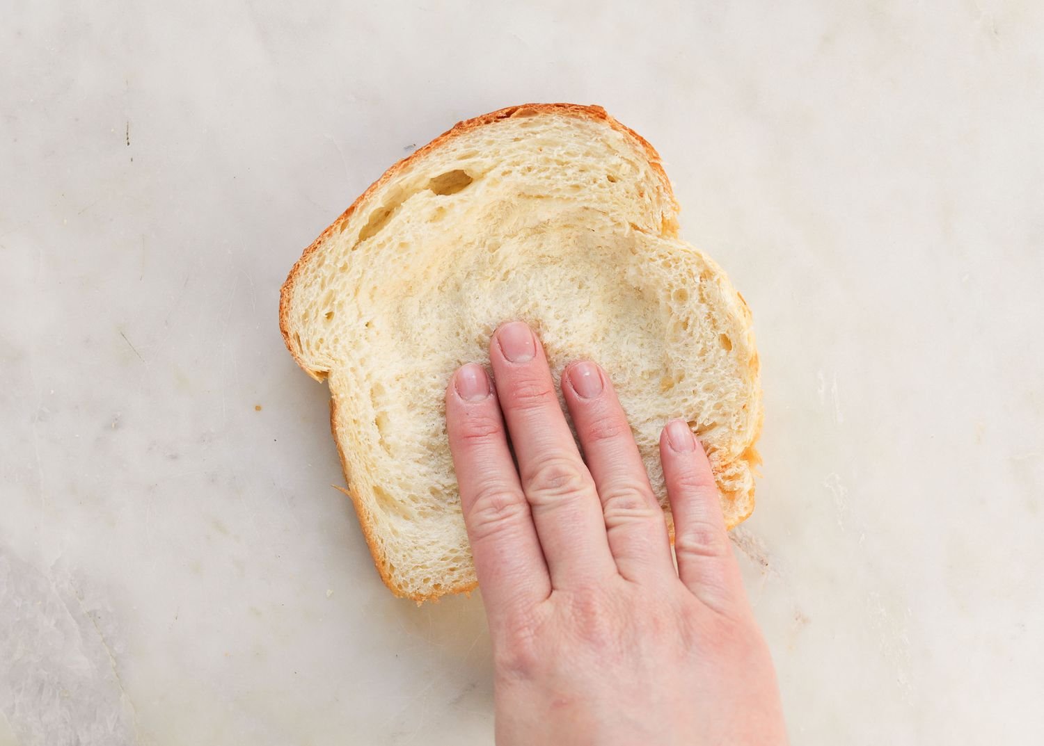 Making a well in a slice of bread