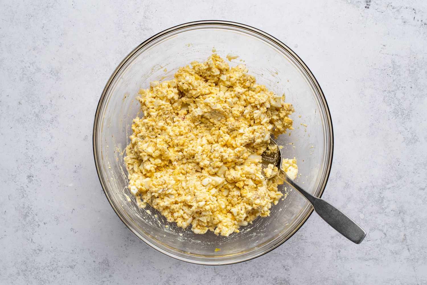 Classic Egg Salad With Relish in a bowl, with a spoon
