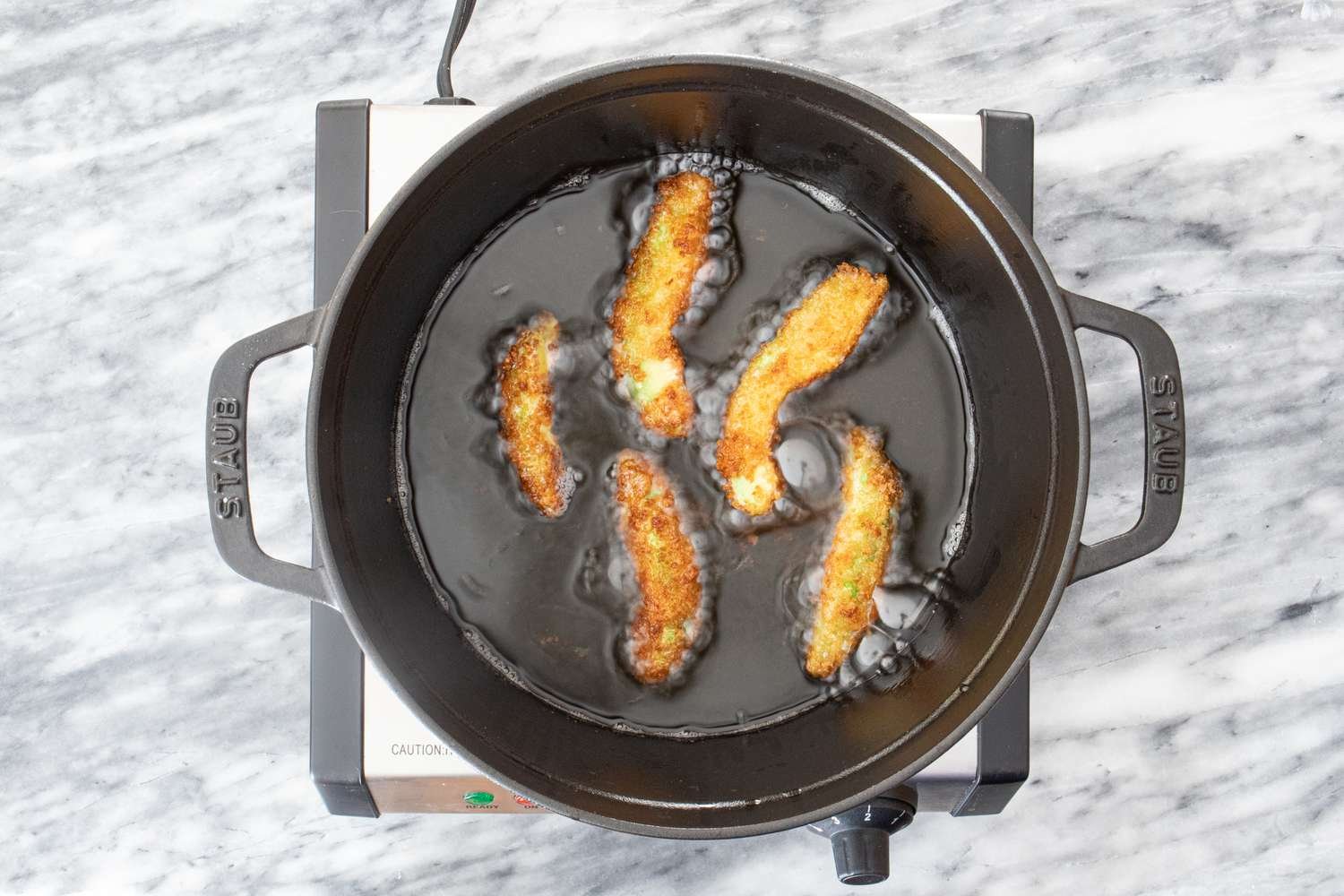 frying panko coated avocado slices