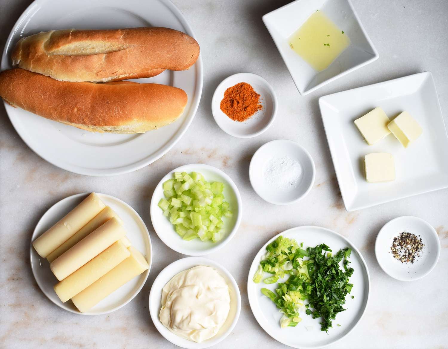 Vegan lobster roll ingredients on a marble platter